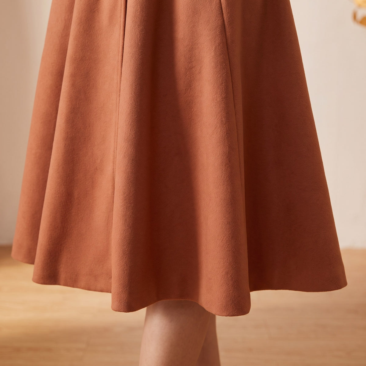 Fiorella coat, Terracotta, flared skirt hem close-up