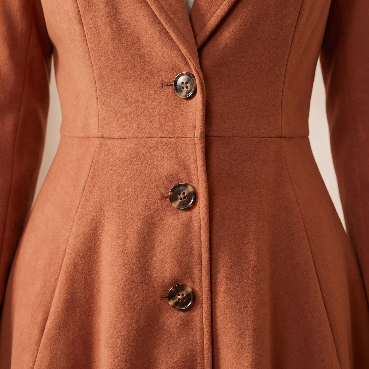Fiorella coat, Terracotta, button front at the waist seam close-up