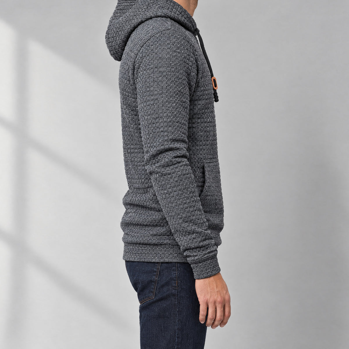 Dorian men's waffle knit pullover hoodie in charcoal, side view