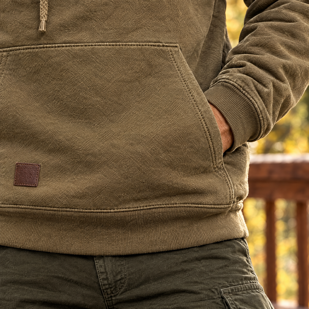 Nico hoodie kangaroo pocket and leather patch, close-up