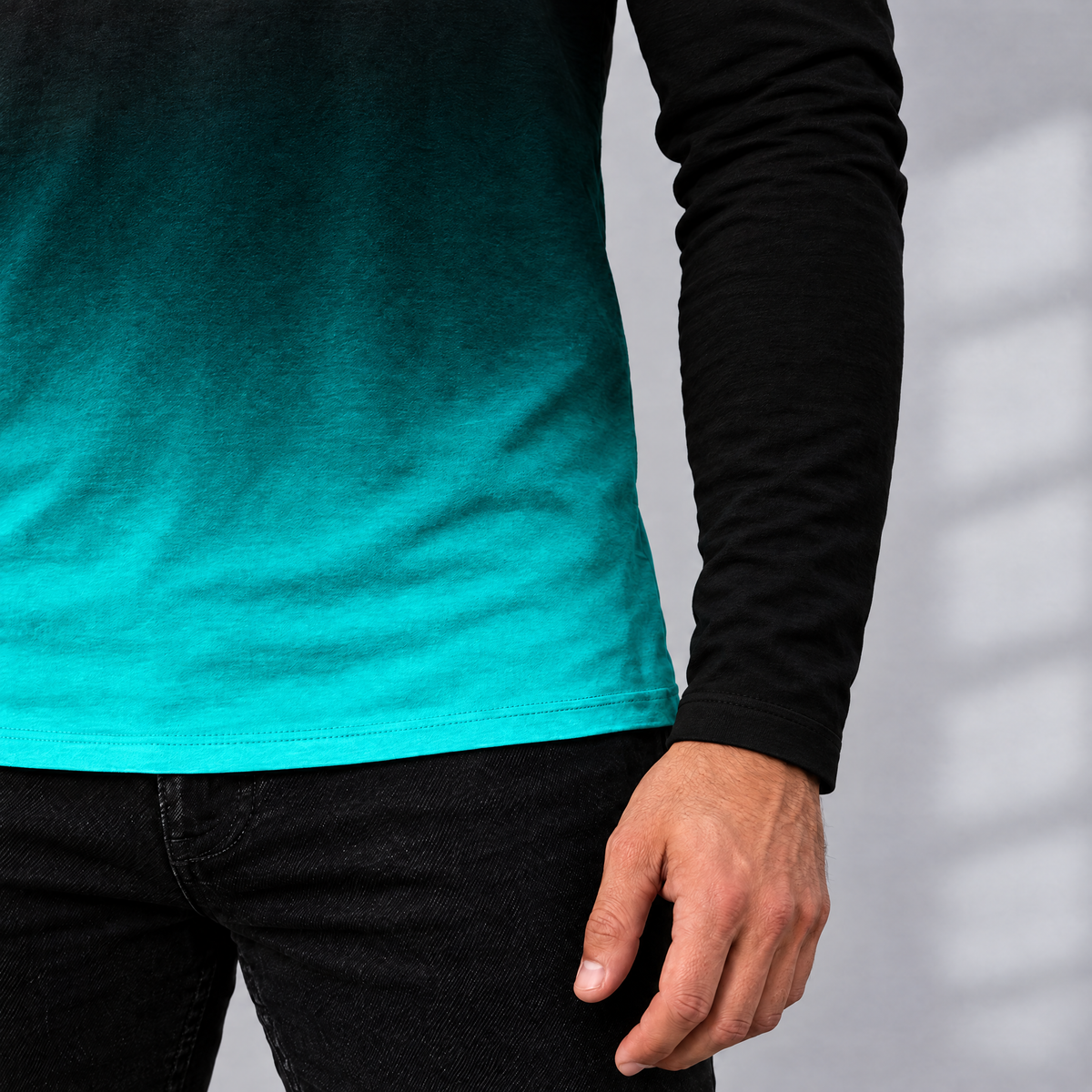 Enzo tee teal gradient hem and solid black sleeve, close-up