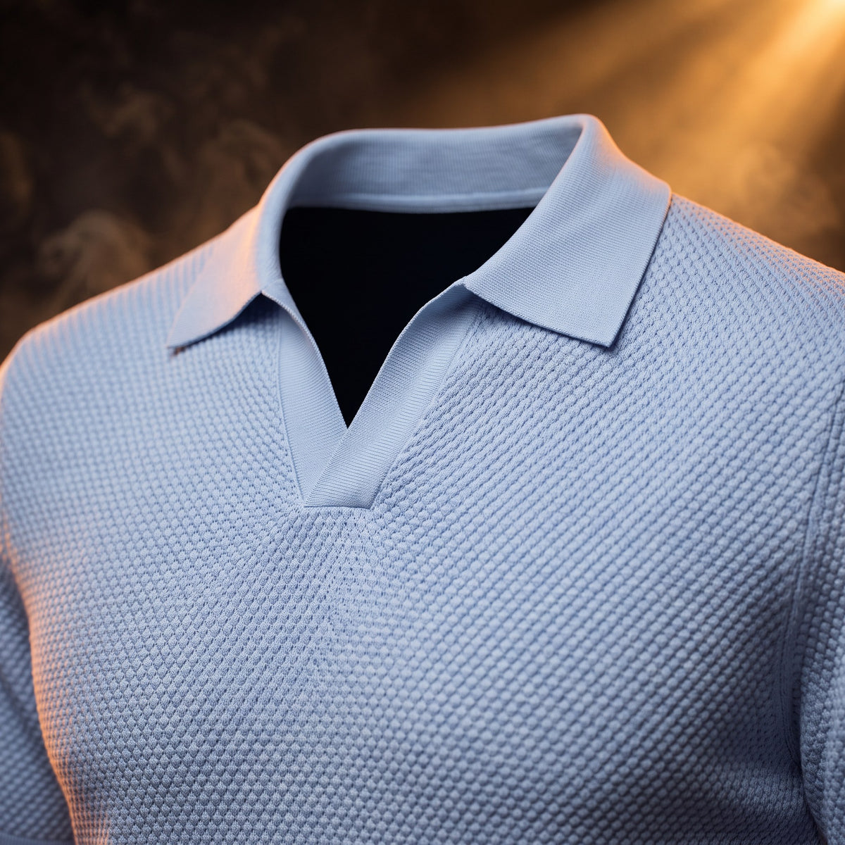 Amedeo knit polo in blue, close-up of the buttonless Johnny collar