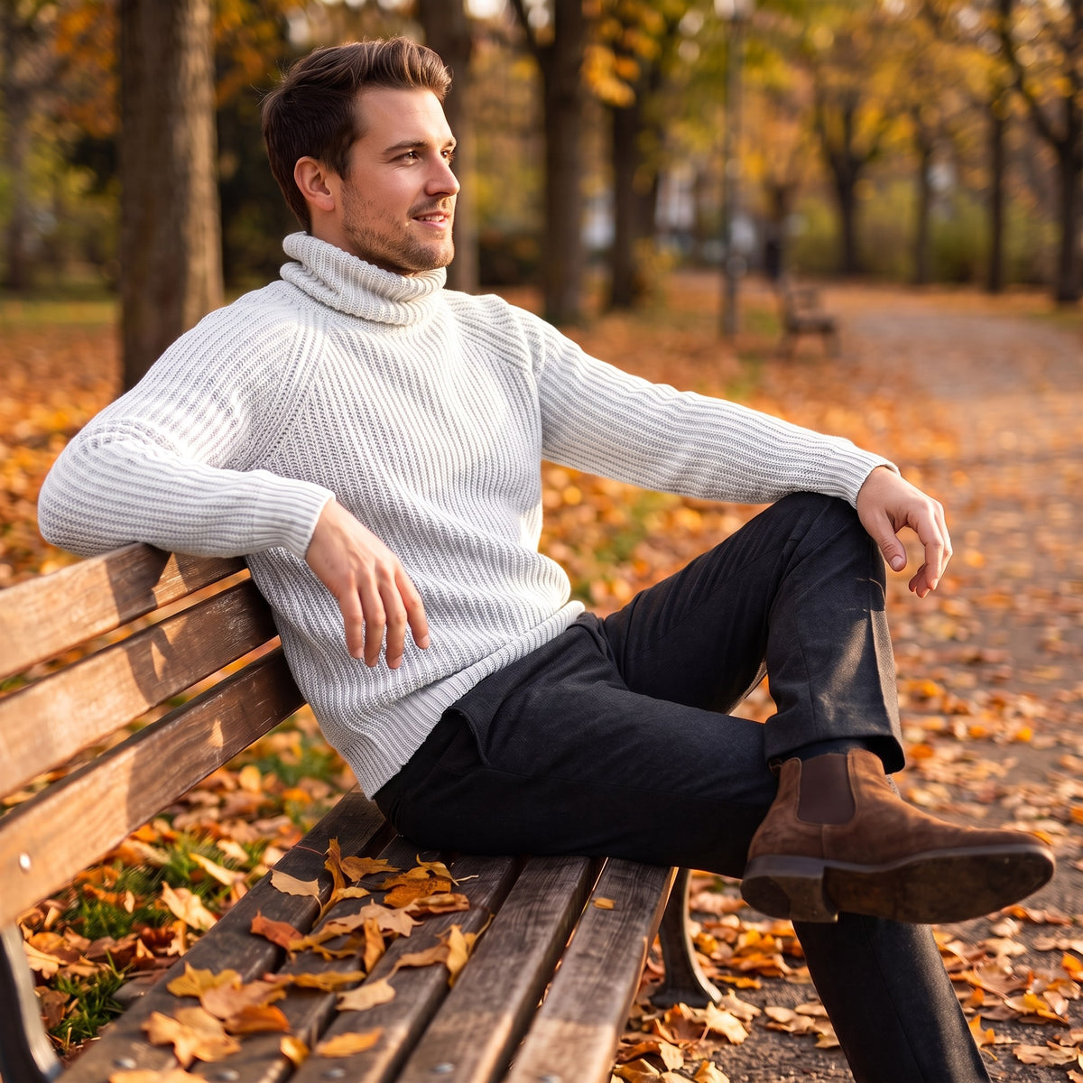 Pietro turtleneck sweater, White, worn on a park bench in autumn