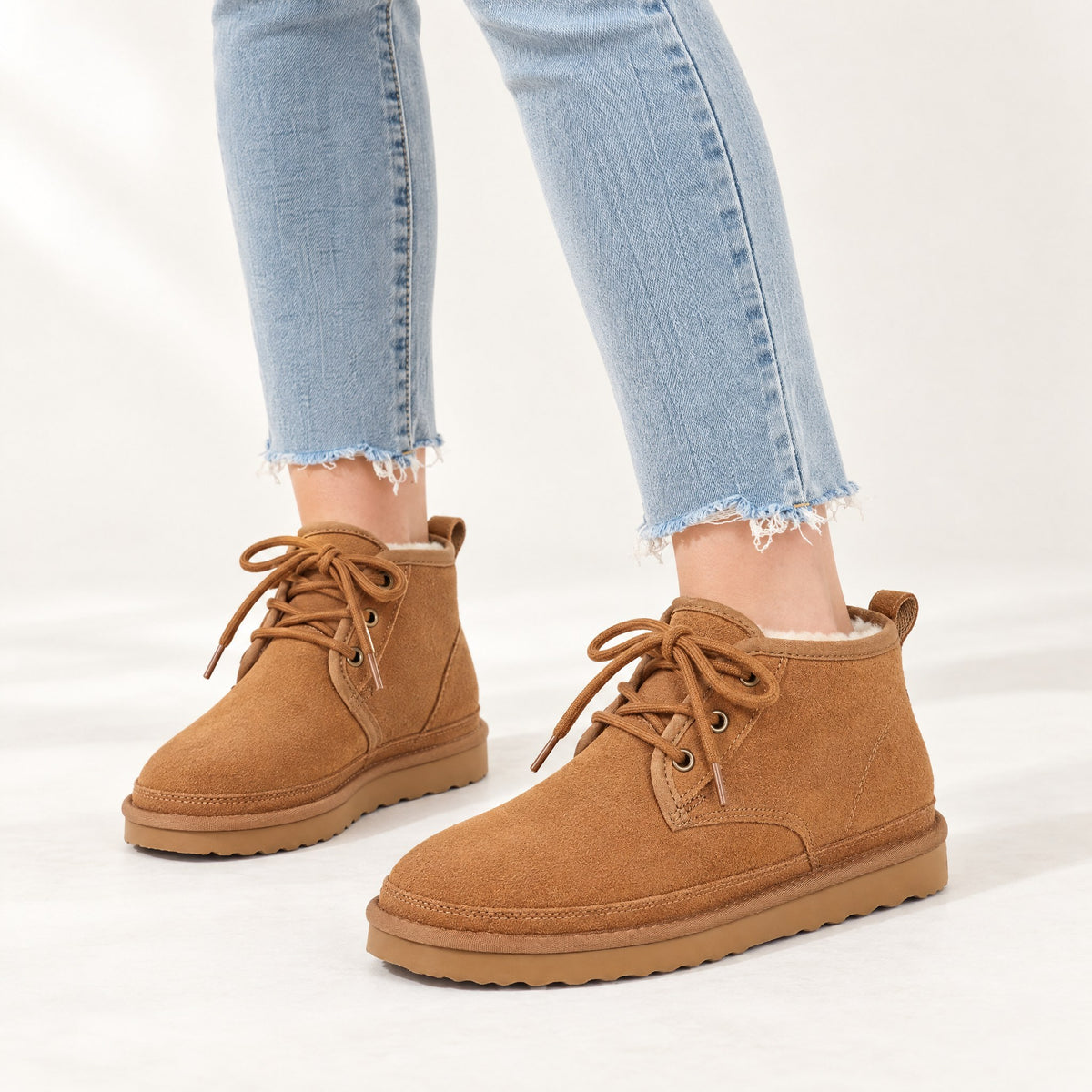 Clementine suede plush lined lace up ankle boots in tan, worn with cropped jeans