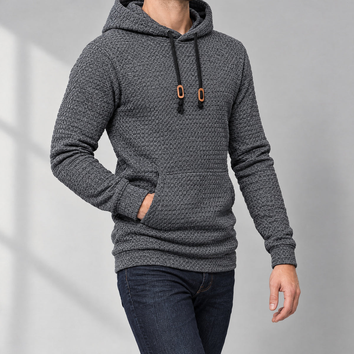 Dorian men's waffle knit pullover hoodie in charcoal, three-quarter view