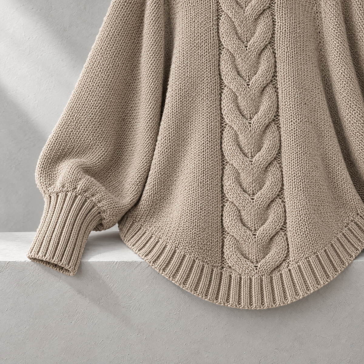 Elena Oversized Cable Knit High Neck Sweater for Women - A curved finish.