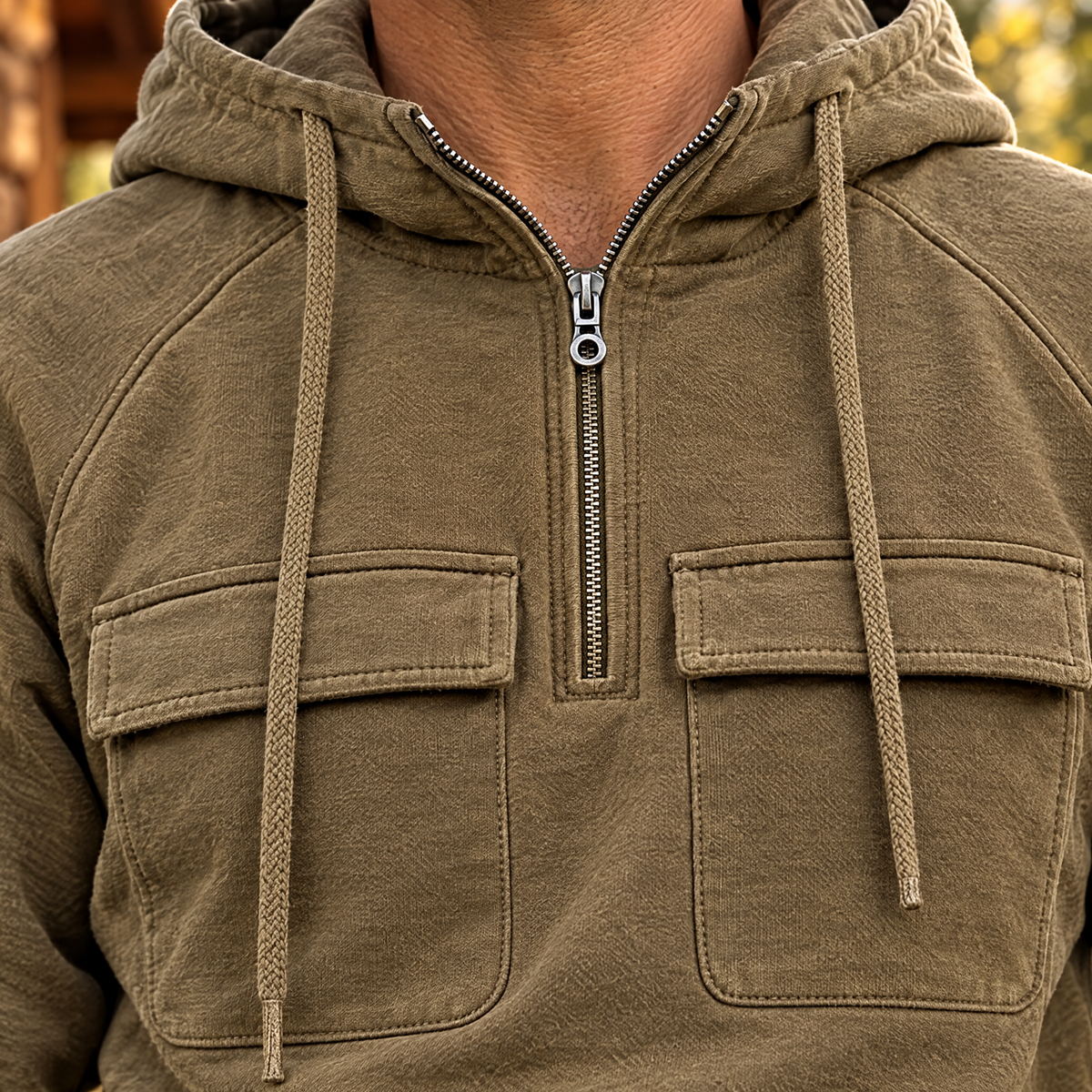 Nico hoodie quarter zipper, drawstrings and chest flap pockets, close-up