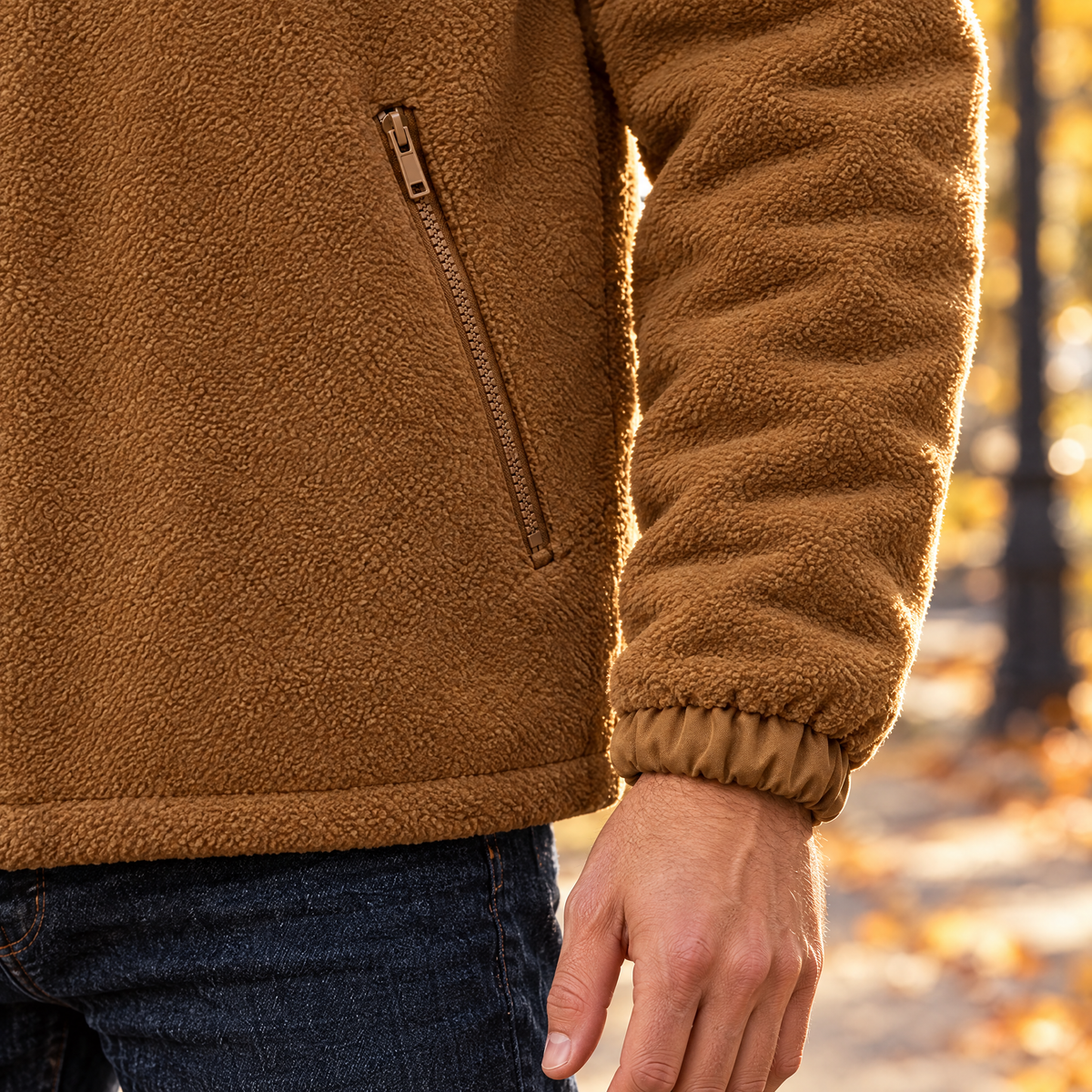 Cesare fleece jacket close-up of the slanted zip pocket and elastic cuff